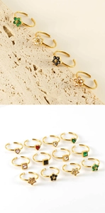 Detailed collection of 18K gold plated stainless steel rings with colorful gems and flower designs
