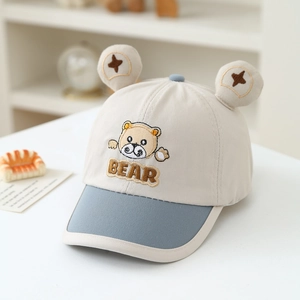 Detail of baby bear baseball cap with 3D plush ears and cute animal embroidery