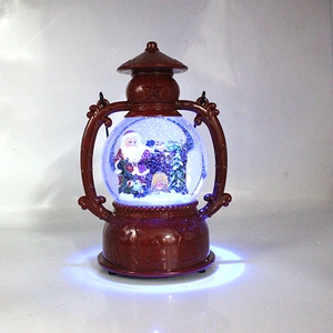 Close-up of Santa Claus and tree inside a lighted vintage Christmas water lantern