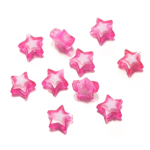 Macro shot of two-tone rose red and white acrylic star beads for DIY jewelry making