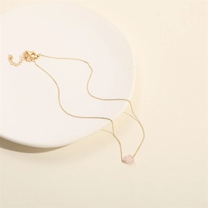 Minimalist heart-shaped pink quartz necklace with adjustable gold chain for women