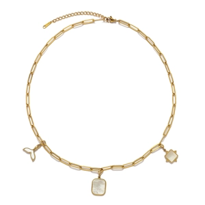 Detail of stainless steel necklace with fish tail and star shell charms in gold finish