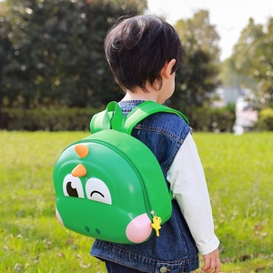 Green dinosaur eggshell backpack for kids with cute cartoon 3D details and durable straps