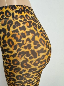 Detailed side view of leopard print leggings showing elastic fit and textured pattern