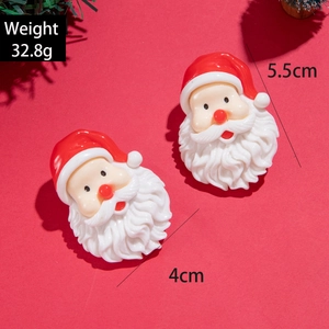 Détails des boucles d'oreilles Père Noël avec dimensions 5,5cm x 4cm et poids de 32,8g