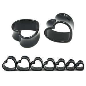 Macro display of black acrylic heart-shaped ear gauges in various size ranges