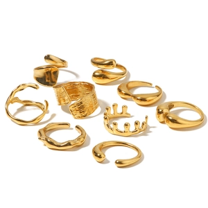 Set of 9 gold irregular geometric open rings with wave, fold, and crown designs