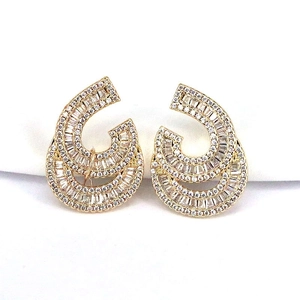 Golden geometric C-shaped earrings with clear cubic zirconia in a symmetrical layout