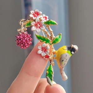 Pastoral bird and raspberry brooch with colorful enamel petals and gold alloy base
