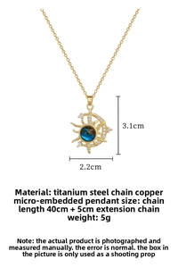 Detail view of gold celestial necklace with blue stone pendant and size measurements