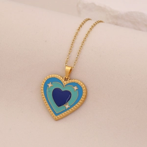 Gold stainless steel heart necklace with blue and teal enamel inlay and star patterns