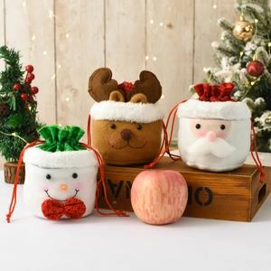 Three-piece Christmas drawstring gift bags featuring snowman, reindeer, and Santa designs