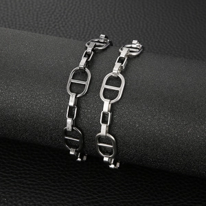 Mens silver anchor chain bracelets with oval link design on black display background