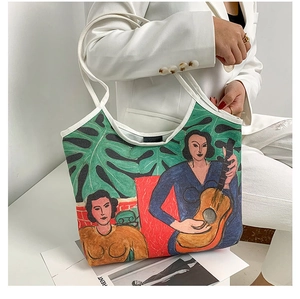 Artistic oil painting tote bag featuring Matisse style pattern on a model in white blazer