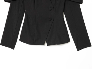 Detailed close-up of premium twill fabric texture on a black slim fit blazer jacket
