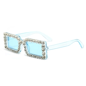 Square blue rhinestone sunglasses with light blue lenses for a trendy retro street look