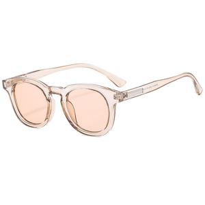 Fashionable round sunglasses in champagne frames and orange lenses at a 45-degree angle