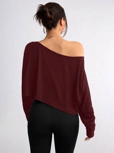 Rear view detail of wine red off-shoulder long sleeve top with asymmetric neckline