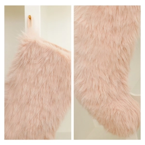 Pink faux fur Christmas stocking ornament with soft plush texture and hanging loop