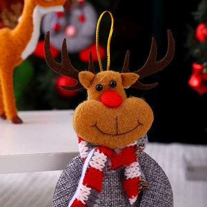 Close-up of a handmade felt reindeer ornament with a striped scarf and gold hanging loop