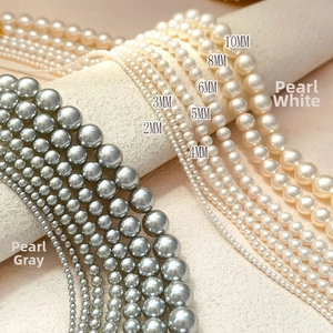 Comparison of white and grey crystal pearl beads in various sizes from 2mm to 10mm