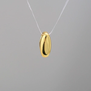 Polished golden oval bubble letter pendant necklace with a modern minimalist metallic finish