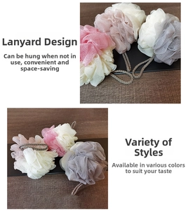 Detail of soft mesh bath sponge with dual-color splicing and convenient hanging lanyard