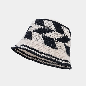 Detailed close-up of handmade crochet hollow diamond pattern on a cotton bucket hat