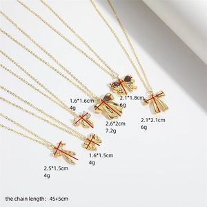 Golden Hawaiian bow pendant necklaces in various styles on a clean white background