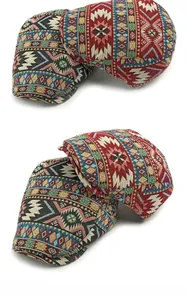 Detailed view of bohemian jacquard woven patterns on retro flat caps in two colors