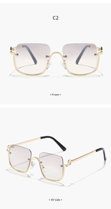 Detail view of square semi-rimless sunglasses with gold metal frame and purple gradient lenses