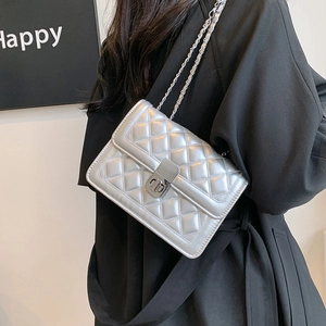 Silver quilted chain crossbody bag for women with metallic finish and rotary lock buckle