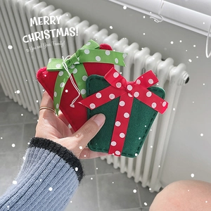 Christmas felt ornaments in red and green with white polka dot bows for holiday decor