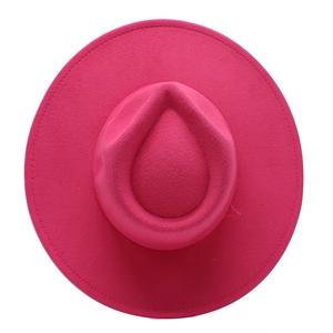 Deep pink wool felt fedora with a wide brim and concave crown design on white background