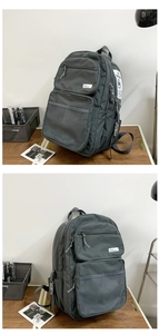 Detail view of large nylon backpack featuring side adjustment buckles and mesh front pockets