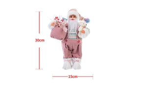 Dettaglio della statuina di Babbo Natale rosa da 30 cm con sacco regalo e orsetto