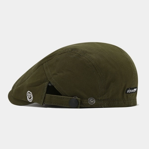 Detail of army green beret cap featuring since 1991 woven label and canvas texture