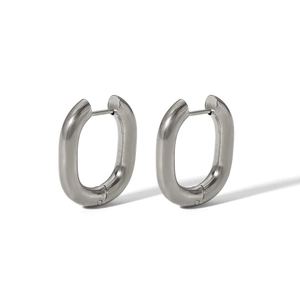 Detailed view of polished oval hoop earrings with a secure snap closure design