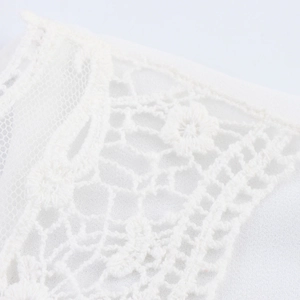 Elegant white chiffon blouse featuring intricate lace details and flared sleeves