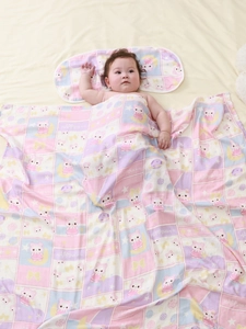 Bamboo cotton baby blanket and pillow set with bear pattern and sleeping newborn