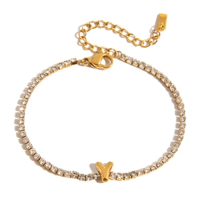 Close-up of 18K gold-plated tennis bracelet with zircon heart and lobster clasp details