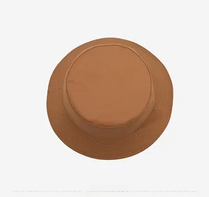 Detailed top view of caramel brown canvas bucket hat showing fine stitching and durable fabric