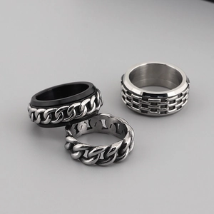 Three pieces of vintage stainless steel rotating chain rings for men in punk hip-hop style