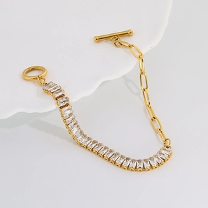 Detail of gold titanium bracelet with cubic zirconia inlay and elegant OT toggle clasp