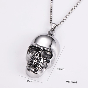Detailed view of skull pendant dimensions: 63mm height and 35mm width in stainless steel