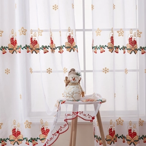 Christmas sheer curtains with snowflake and bell embroidery in festive home setting