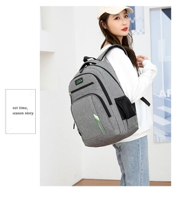 Side view of grey large capacity business laptop backpack with breathable straps
