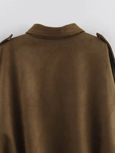 Close-up of brown suede bomber jacket showing shoulder epaulets and matte texture detail