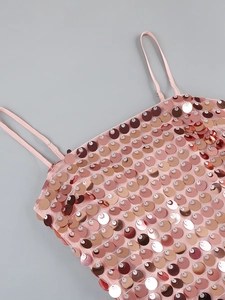 Detail of rose gold fish scale sequins on mesh fabric with adjustable thin strap