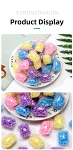 Detail of colorful laundry scent booster beads in water-soluble individual packaging